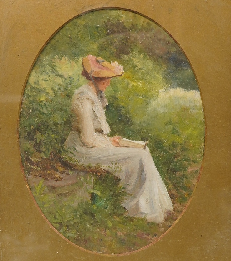 Fred Colin Tilney (1870-1951), oval oil on canvas, Study of an Edwardian seated lady reading, 23 x 17cm. Condition - fair, canvas not flat within the frame